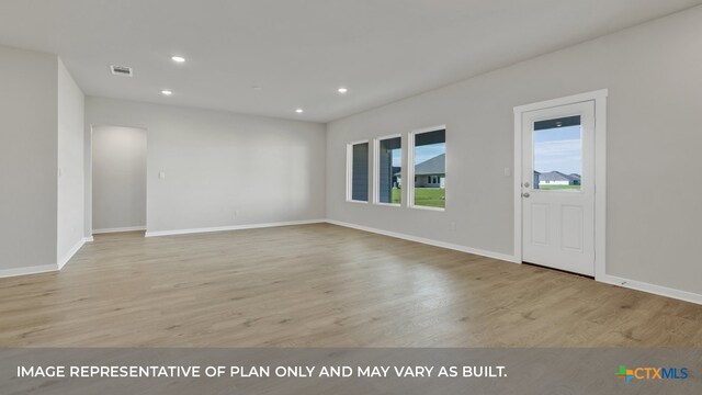 empty room with light wood-type flooring