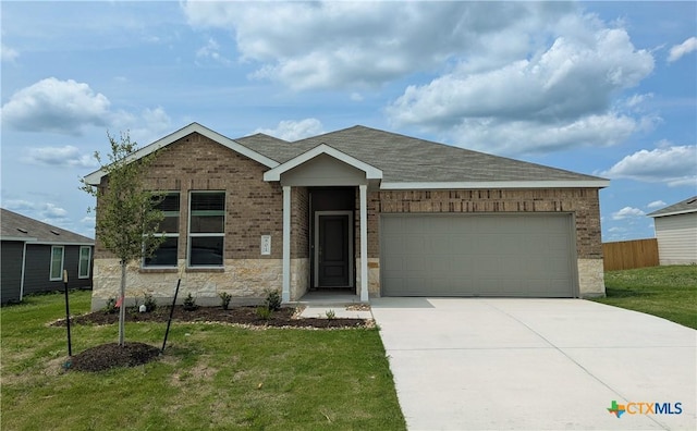 801 Bobby Lou Ln, Copperas Cove, TX 76522 - ranch-style house featuring a garage, brick siding, concrete driveway, and a front lawn