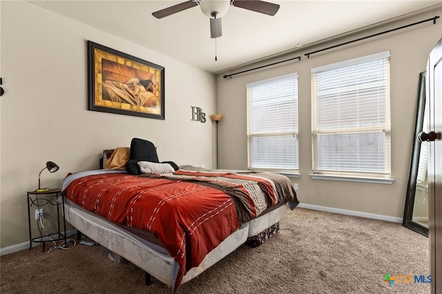 carpeted bedroom with baseboards and ceiling fan