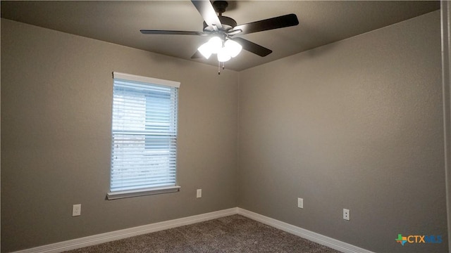 carpeted empty room featuring ceiling fan