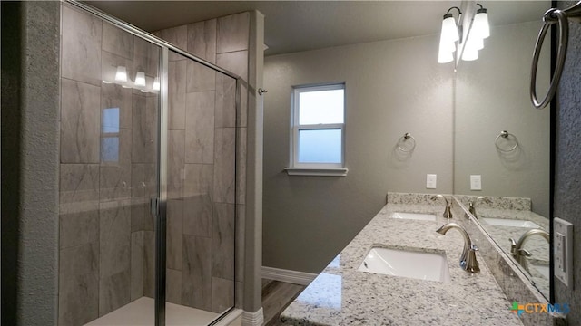 bathroom with vanity and an enclosed shower