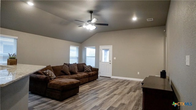 living room with vaulted ceiling, ceiling fan, and hardwood / wood-style floors