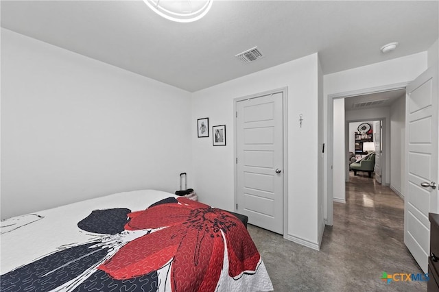 bedroom featuring concrete floors