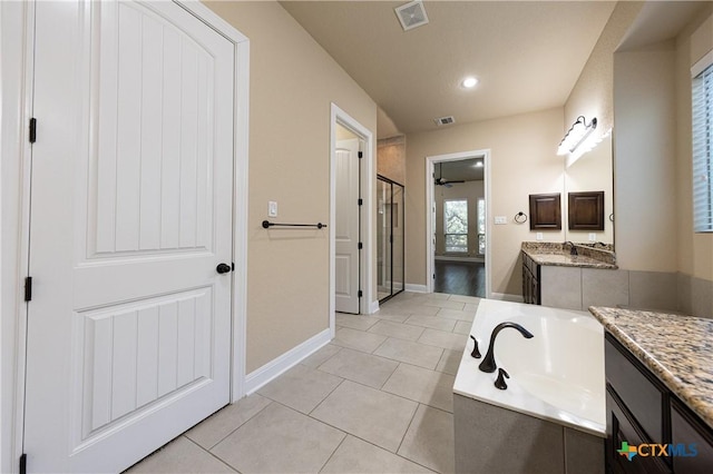 26815 Tulip Mdw, Boerne, TX 78015 - full bathroom with vanity, a stall shower, a garden tub, tile patterned floors, and a ceiling fan