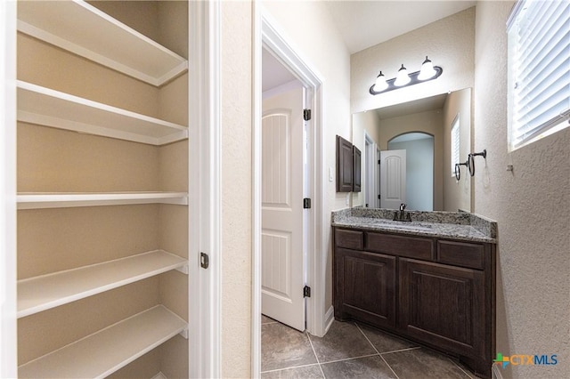 26815 Tulip Mdw, Boerne, TX 78015 - bathroom featuring vanity, tile patterned floors, and a textured wall
