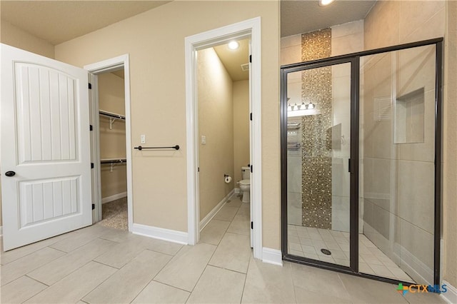 26815 Tulip Mdw, Boerne, TX 78015 - full bathroom with a stall shower, a walk in closet, tile patterned flooring, and recessed lighting