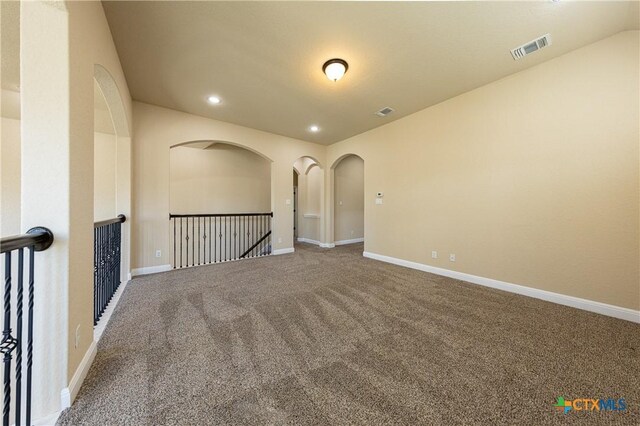 26815 Tulip Mdw, Boerne, TX 78015 - spare room with carpet flooring, recessed lighting, and arched walkways