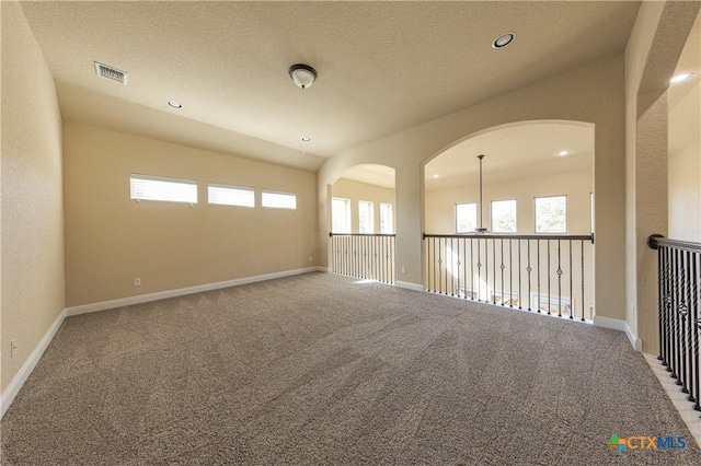 26815 Tulip Mdw, Boerne, TX 78015 - carpeted spare room with recessed lighting and arched walkways