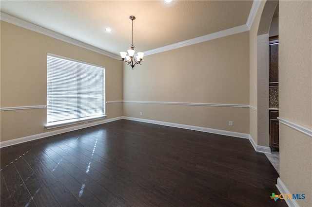 26815 Tulip Mdw, Boerne, TX 78015 - unfurnished room with a chandelier, ornamental molding, dark wood-style floors, and arched walkways