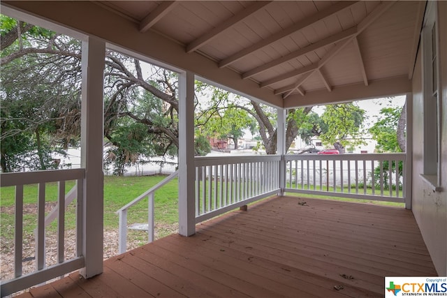 wooden terrace with a yard