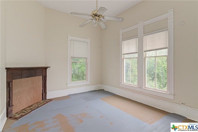 unfurnished living room featuring ceiling fan