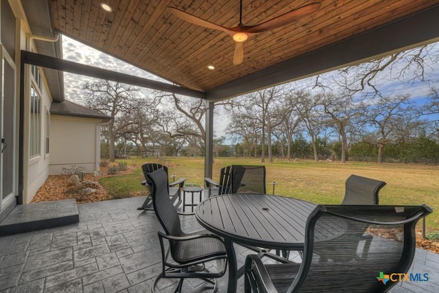 view of patio / terrace with a ceiling fan and outdoor dining space