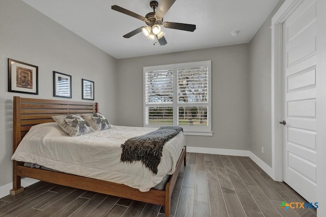 bedroom featuring baseboards, ceiling fan, and wood tiled floor