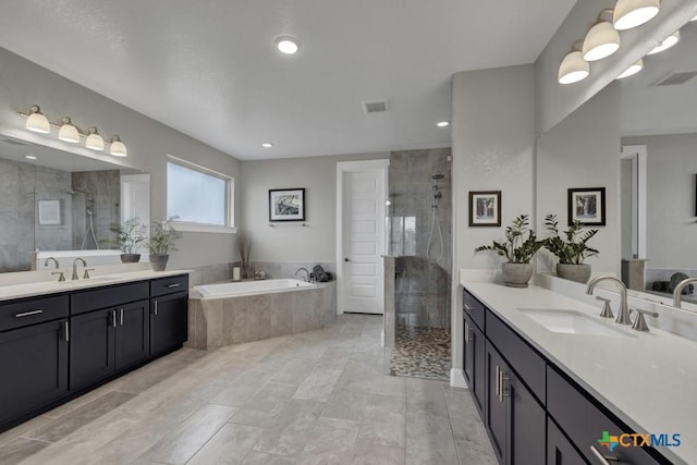 full bath featuring a stall shower, visible vents, and a sink