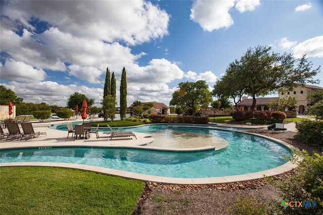 pool featuring a patio area