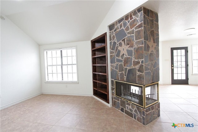 2216 Smith Bluff Rd, Salado, TX 76571 - interior space featuring tile patterned flooring, vaulted ceiling, and baseboards