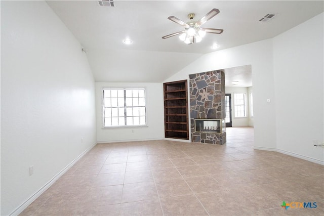 2216 Smith Bluff Rd, Salado, TX 76571 - unfurnished living room with a ceiling fan, light tile patterned floors, lofted ceiling, a fireplace, and baseboards