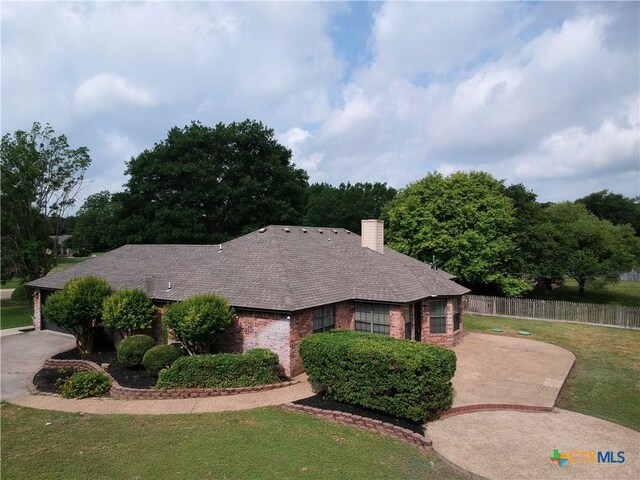 2216 Smith Bluff Rd, Salado, TX 76571 - ranch-style home featuring brick siding, a chimney, and a shingled roof