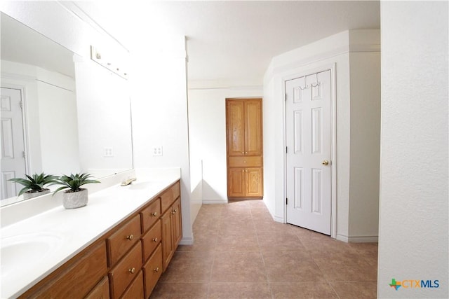 2216 Smith Bluff Rd, Salado, TX 76571 - bathroom featuring double vanity, baseboards, and tile patterned floors
