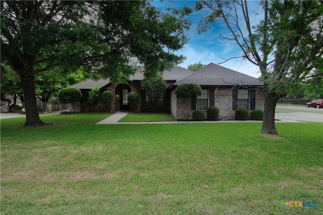 2216 Smith Bluff Rd, Salado, TX 76571 - view of front of house featuring a front lawn and roof with shingles