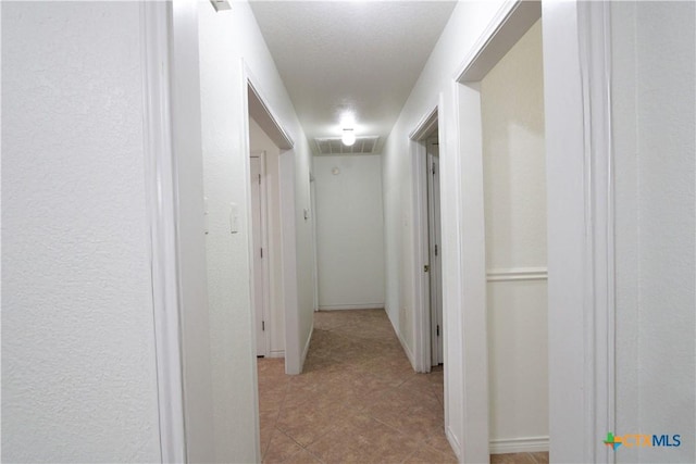 2216 Smith Bluff Rd, Salado, TX 76571 - corridor with tile patterned floors and baseboards