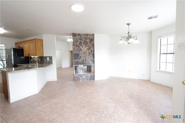 2216 Smith Bluff Rd, Salado, TX 76571 - kitchen featuring stainless steel refrigerator with ice dispenser, plenty of natural light, a chandelier, and open floor plan