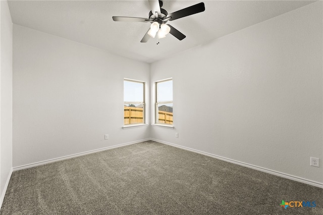 spare room featuring carpet floors and ceiling fan