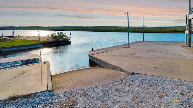 dock area with a water view