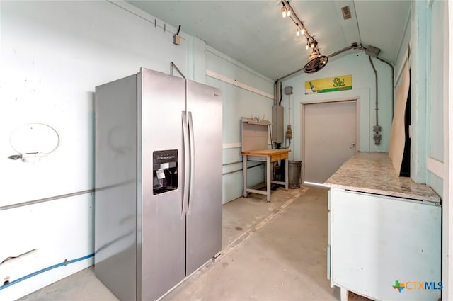 kitchen with stainless steel refrigerator with ice dispenser and gas water heater