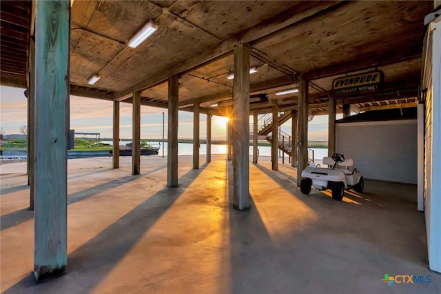 view of horse barn with a water view