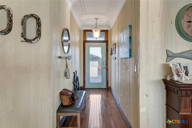 doorway to outside featuring wood walls and hardwood / wood-style flooring