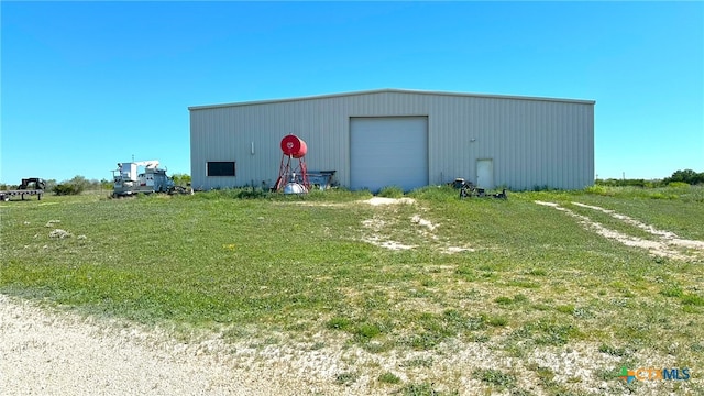 view of outdoor structure with a garage