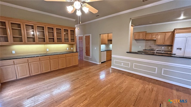 kitchen featuring ornamental molding, light hardwood / wood-style floors, white fridge with ice dispenser, and ceiling fan