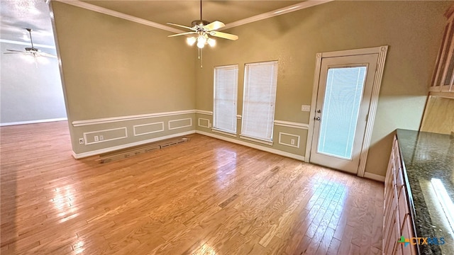 interior space with light hardwood / wood-style floors, ceiling fan, and ornamental molding