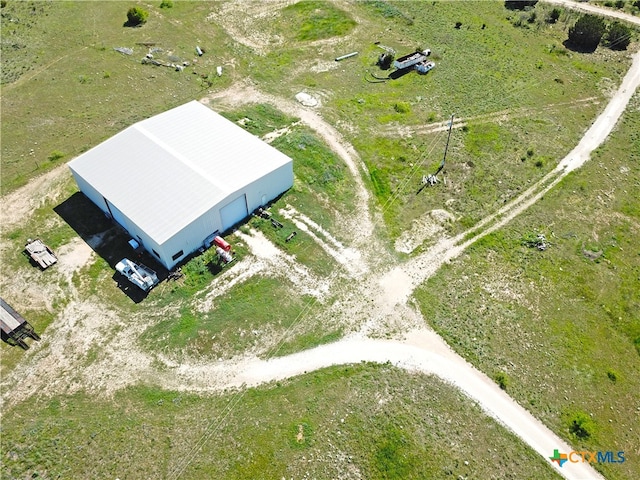 birds eye view of property featuring a rural view