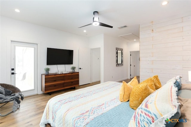 bedroom with ceiling fan and light hardwood / wood-style floors