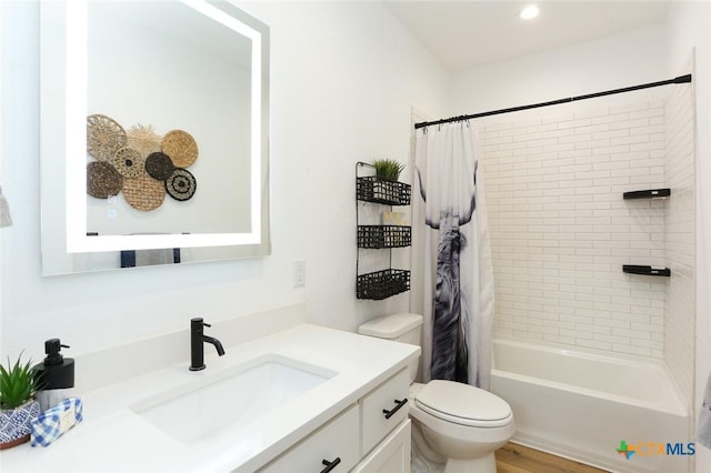 full bathroom featuring wood-type flooring, vanity, toilet, and shower / bathtub combination with curtain