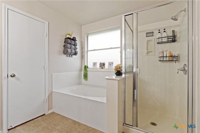bathroom featuring shower with separate bathtub