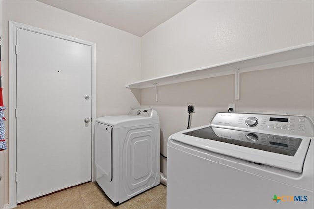 washroom with independent washer and dryer