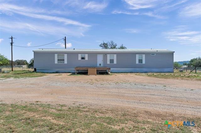 back of property with a wooden deck