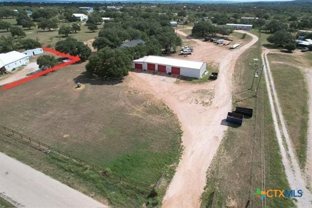 birds eye view of property featuring a rural view