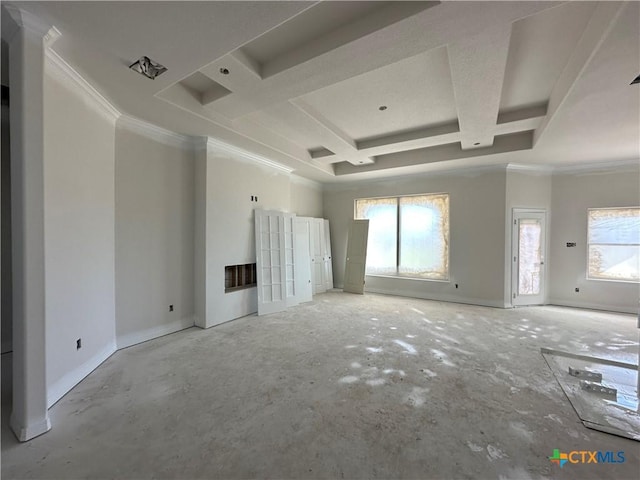 unfurnished living room with coffered ceiling, crown molding, and a tray ceiling