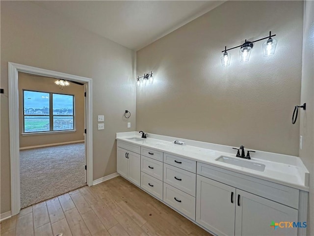 bathroom with vanity and hardwood / wood-style floors