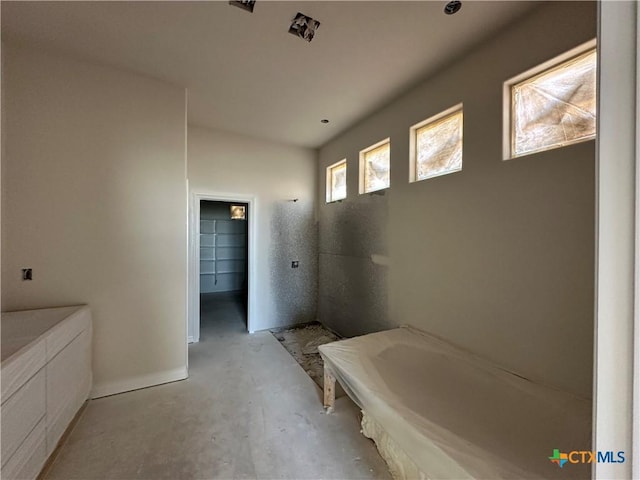 bathroom featuring concrete floors