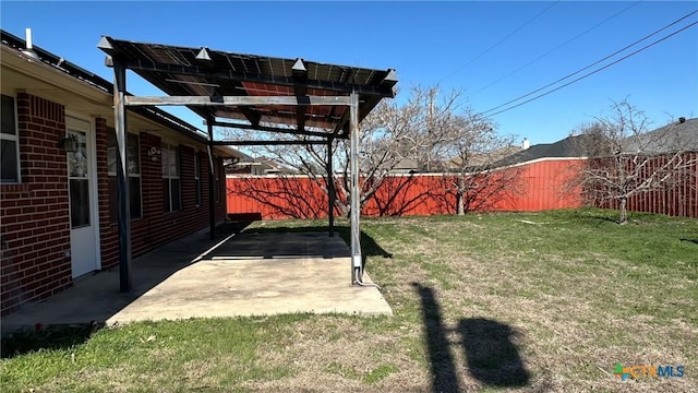 view of yard with a fenced backyard, a pergola, and a patio