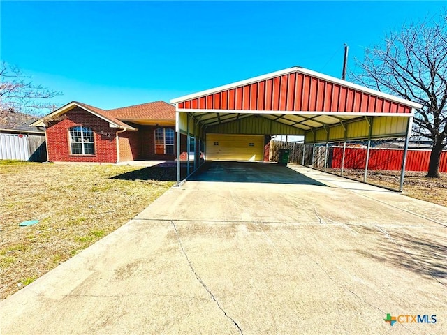 view of front facade with fence, a front lawn, and brick siding