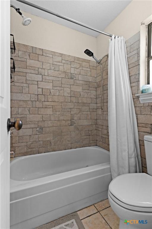 1003 Tyler Dr, Copperas Cove, TX 76522 - full bathroom featuring shower / tub combo with curtain and tile patterned flooring