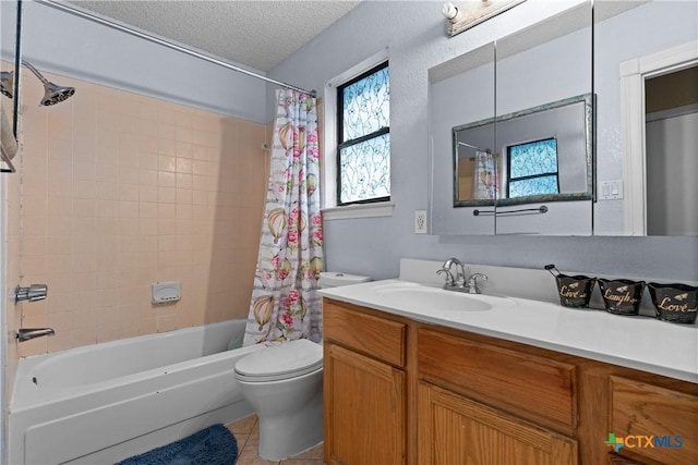 1003 Tyler Dr, Copperas Cove, TX 76522 - full bathroom featuring vanity, shower / bath combo with shower curtain, a textured ceiling, and tile patterned floors