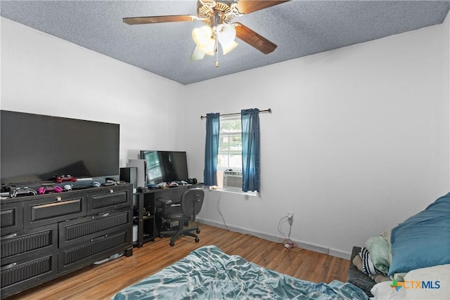 1003 Tyler Dr, Copperas Cove, TX 76522 - office space featuring ceiling fan, wood finished floors, and a textured ceiling