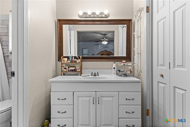 1003 Tyler Dr, Copperas Cove, TX 76522 - bathroom featuring vanity, a ceiling fan, a closet, and a textured wall